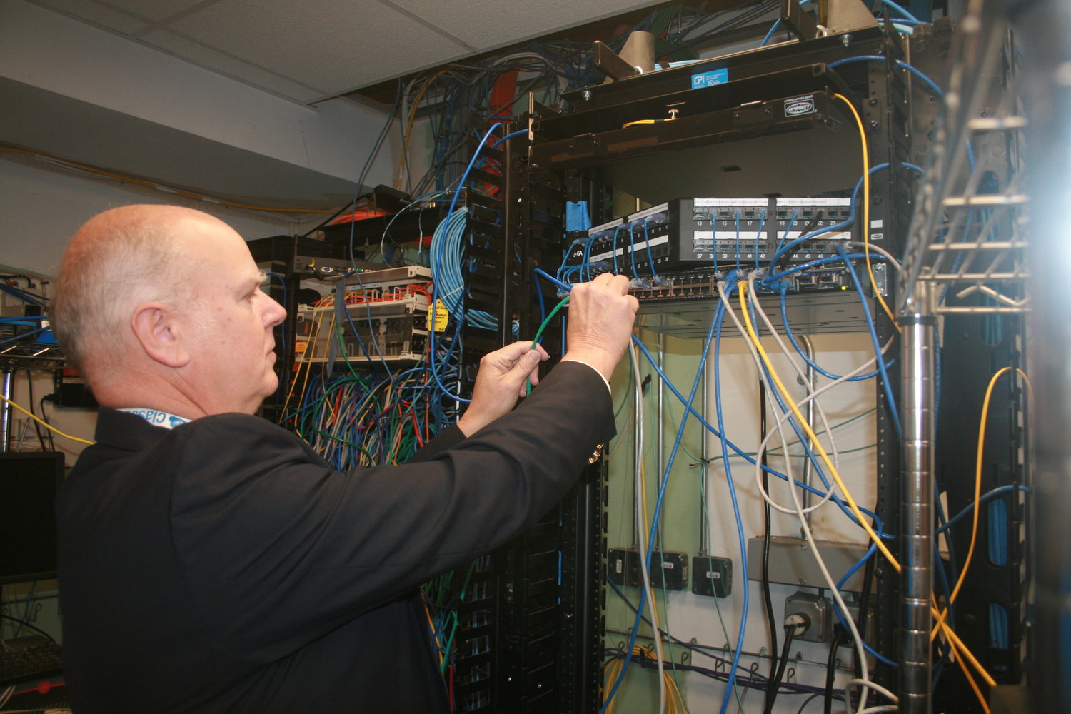 The West Hempstead School District’s director of technology, Vincent Fleck, examined equipment. Ensuring that the network is secure is a constant endeavor.